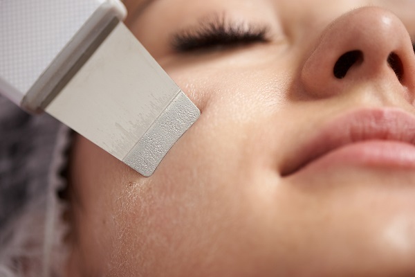 A woman getting a facial treatment